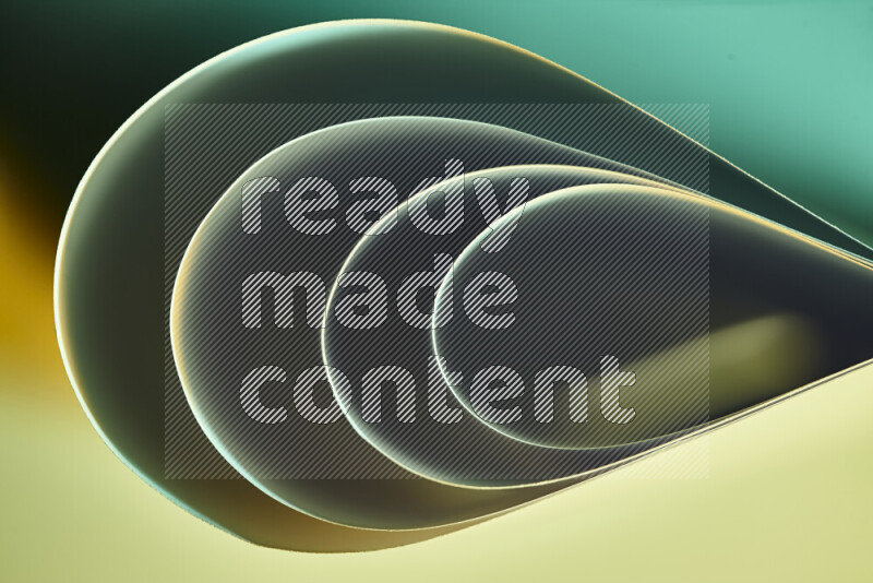 An abstract art of paper folded into smooth curves in green and yellow gradients