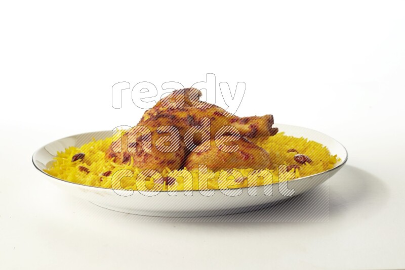 yellow  basmati Rice with kabsa chicken pieces on a white plate with a silver rim direct on white background