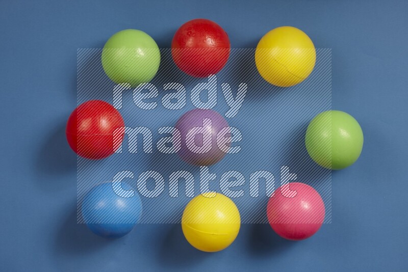 Multicolored plastic balls on different colored backgrounds (kids toys)