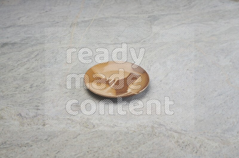 Multicolored Pottery Plate On Grey Marble Flooring