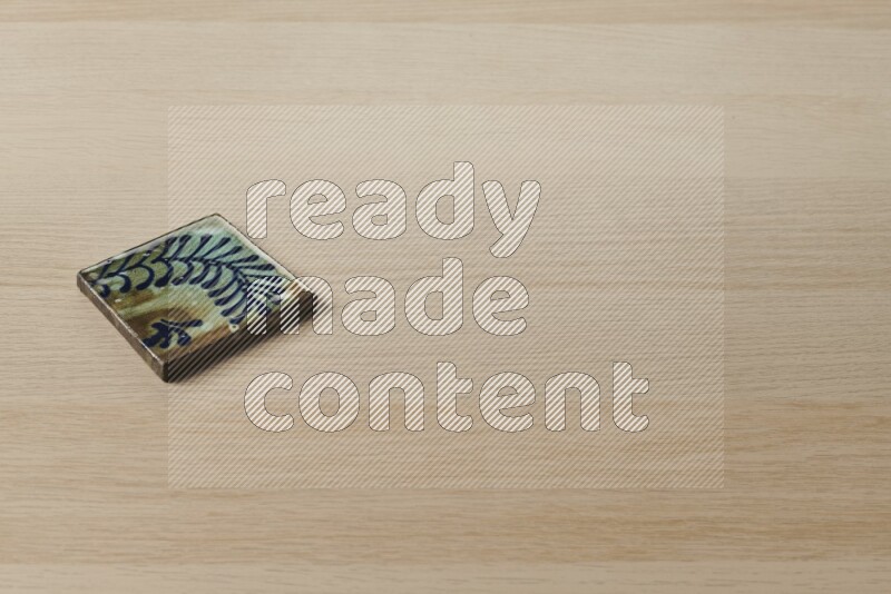 قواعد أكواب مزخرفة على خلفية خشبية فاتحة