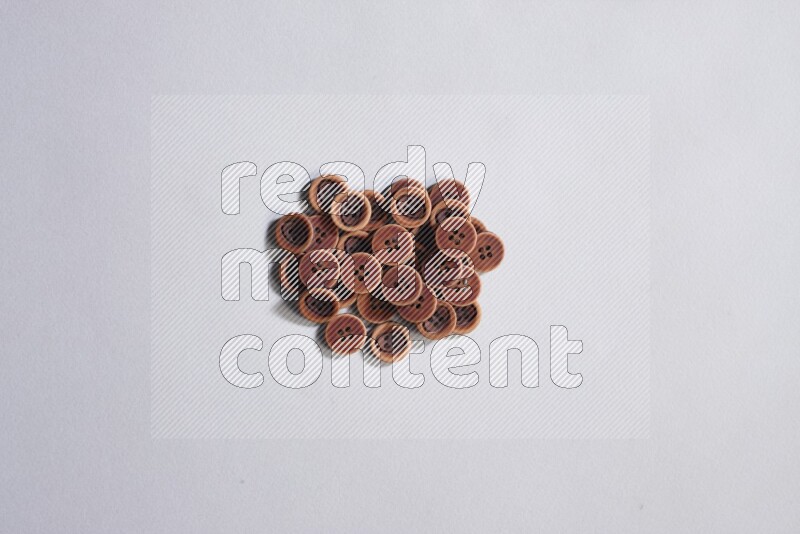 Wooden buttons placed on grey background