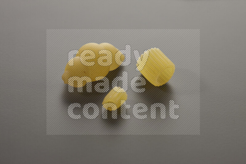 Different pasta types on grey background