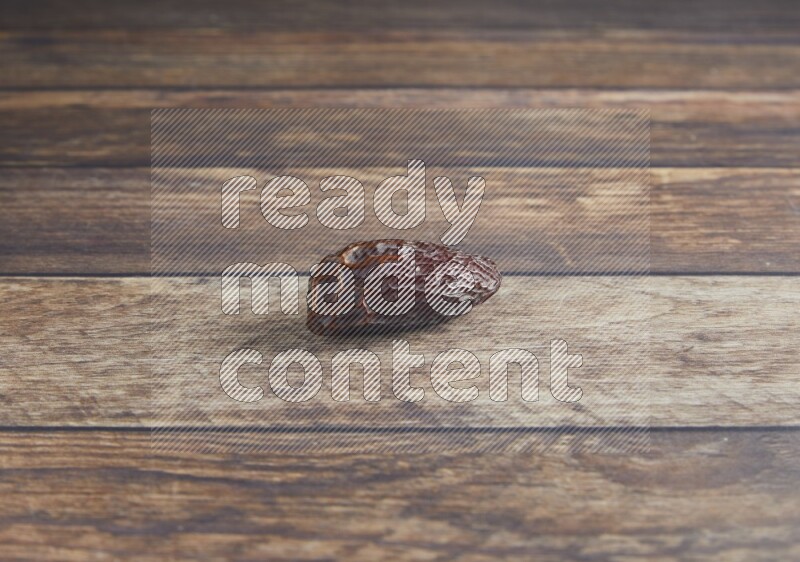 one madjoul date on a wooden background