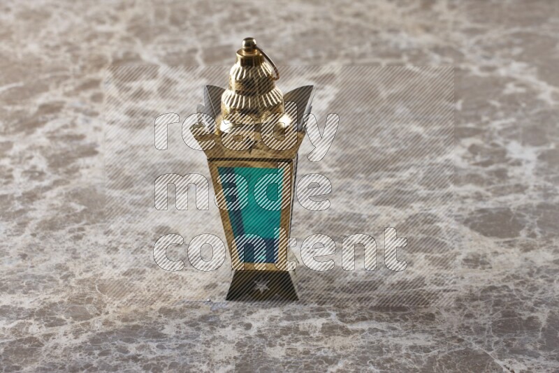 A lantern placed on a beige marble background