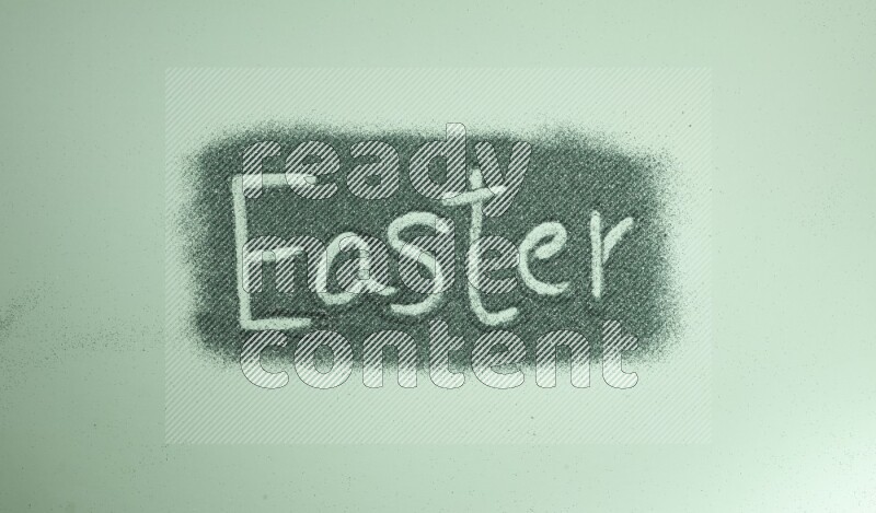 A word written with green glitter on green background