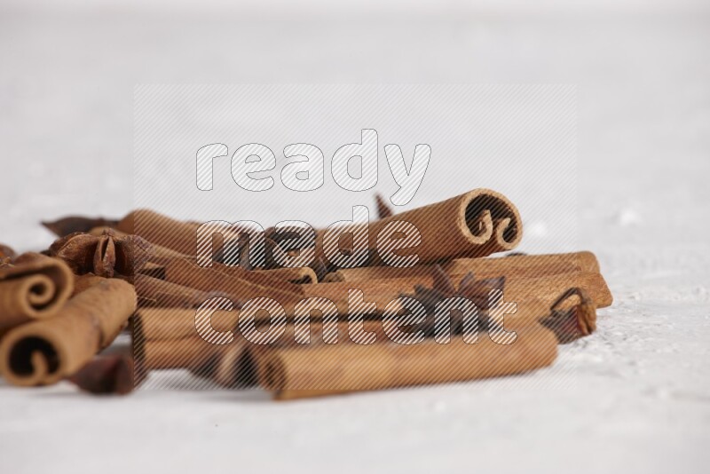 cinnamon sticks with star anise on white background