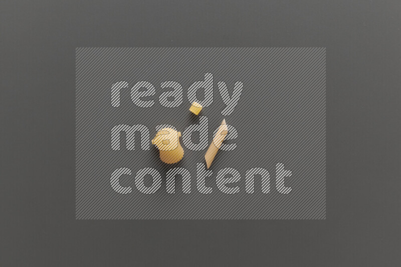 Different pasta types on grey background