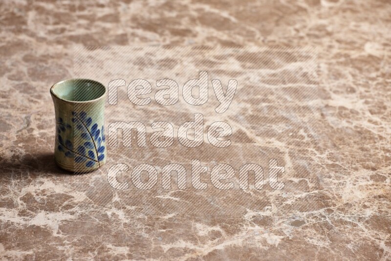 Pottery Cup on Beige Marble Flooring