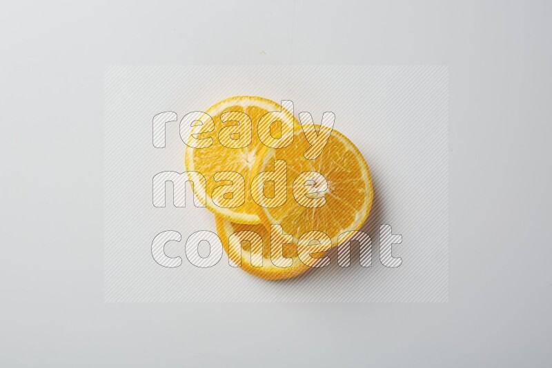 Three orange slices on a white background