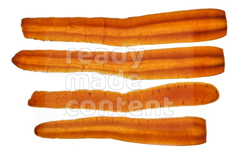 Carrots slices on illuminated white background