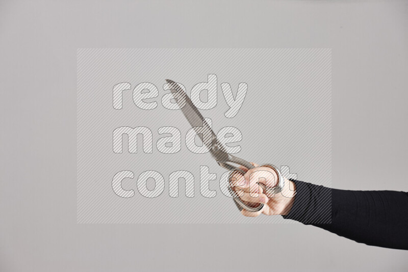 Woman hands holding different metal essentials in different positions