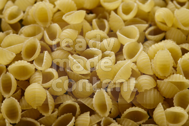 Shells pasta on grey background