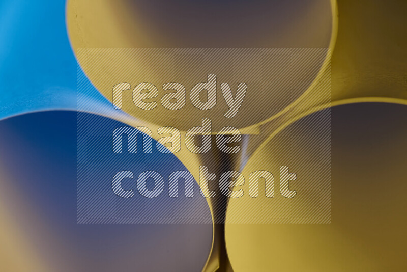 The image shows an abstract paper art with circular shapes in varying shades of blue and warm tones