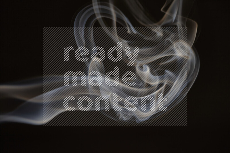 Motion of wavy smoke isolated on dark background
