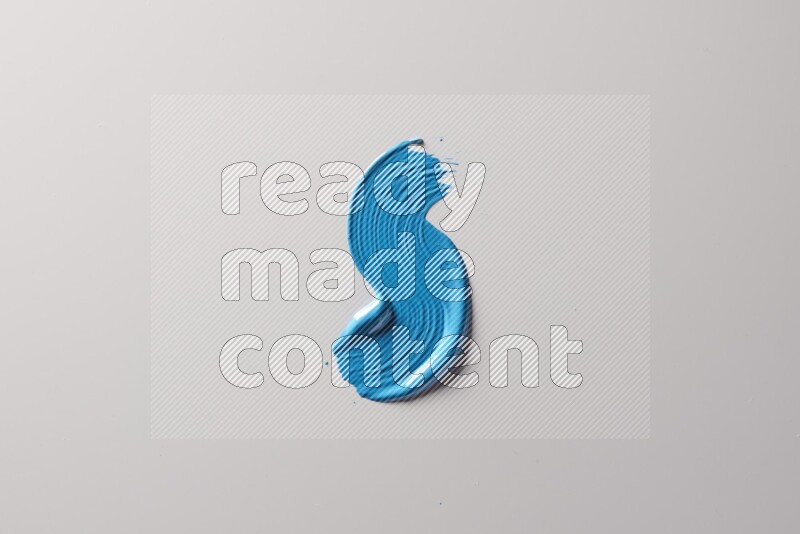 A single blue S curved brush stroke on a white background