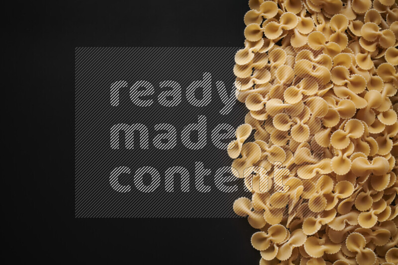 Different pasta types on black background