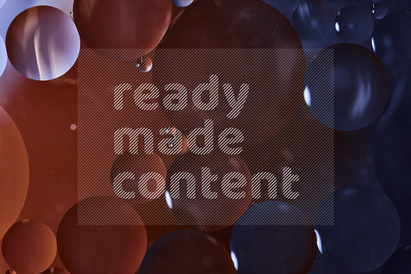 Close-ups of abstract oil bubbles on water surface in shades of black and orange