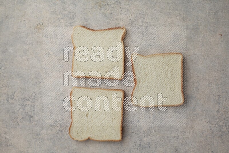 White Toast slices on alight blue textured background