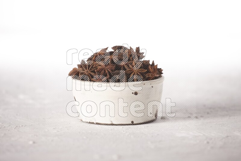 Star Anise in a white bowl on white background