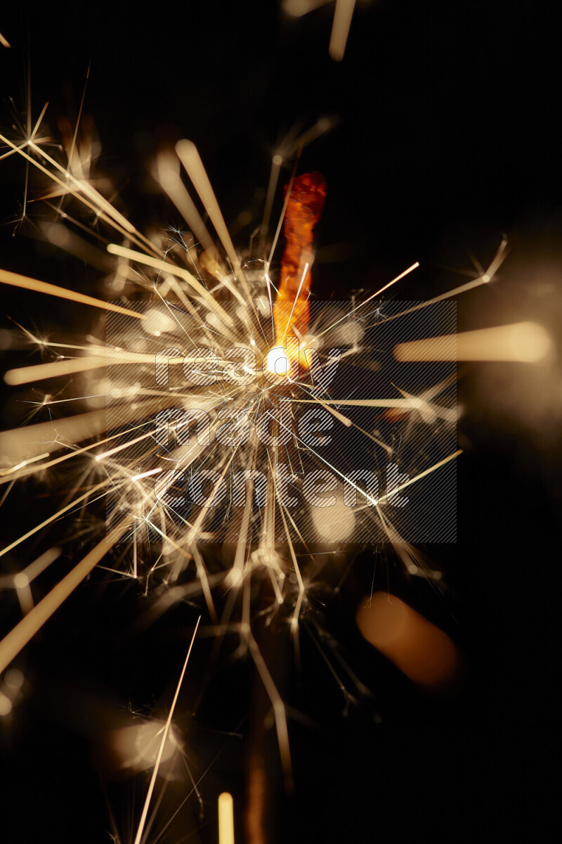 A close-up image of sparkler candle isolated on black background