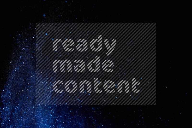Blue glitter powder isolated on black background