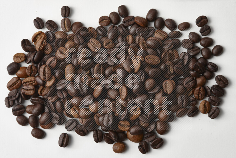 Roasted coffee beans on white background