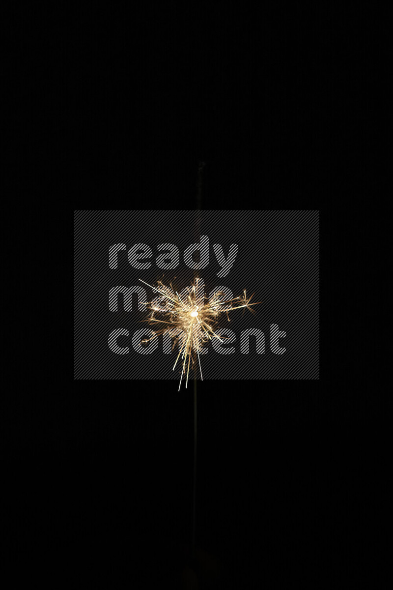 A close-up image of sparkler candle isolated on black background