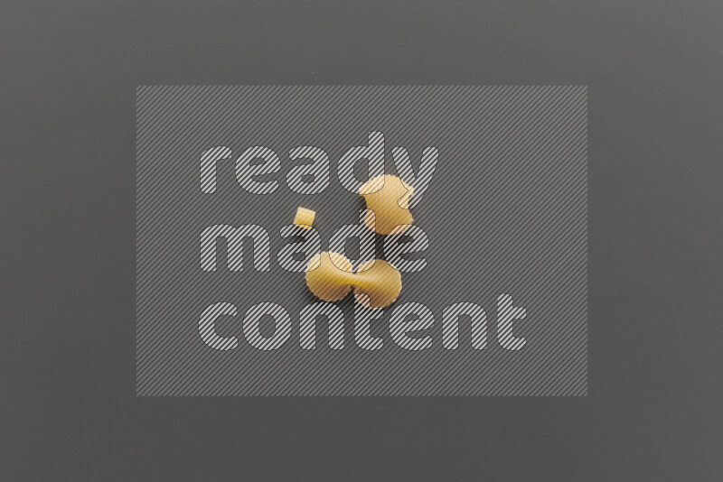 Different pasta types on grey background