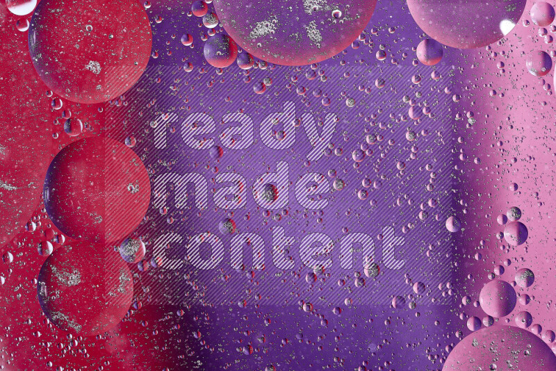 Close-ups of abstract oil bubbles on water surface in shades of red, purple and pink