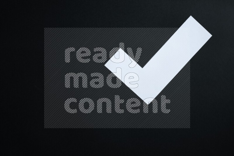 Multicolored paper sheet on black background