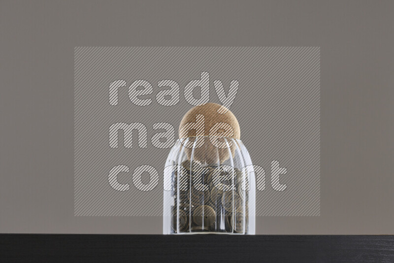 Buttons in a glass jar on black background