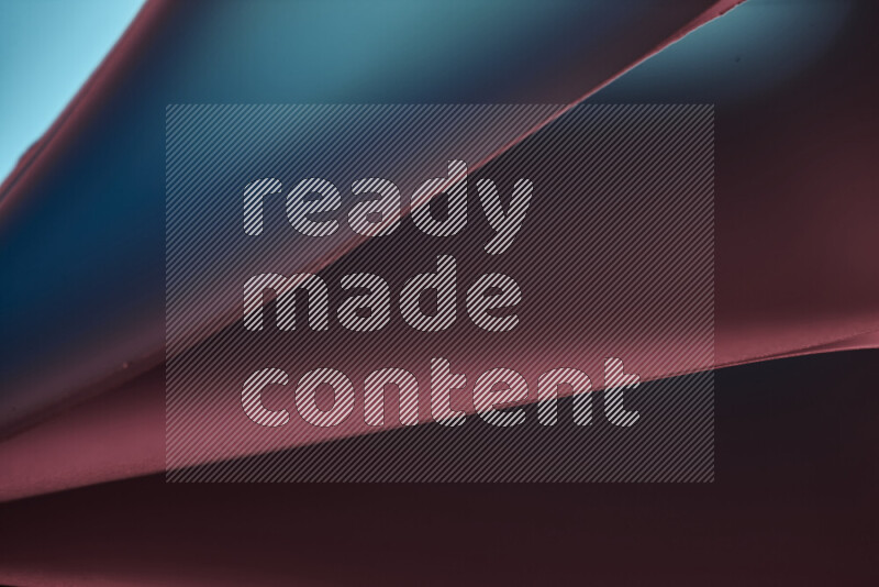 An abstract art piece displaying smooth curves in warm and cold gradients created by colored light