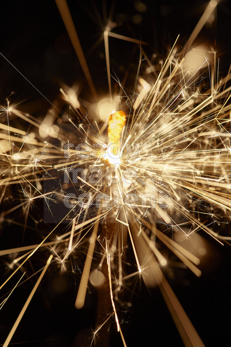 A close-up image of sparkler candle isolated on black background
