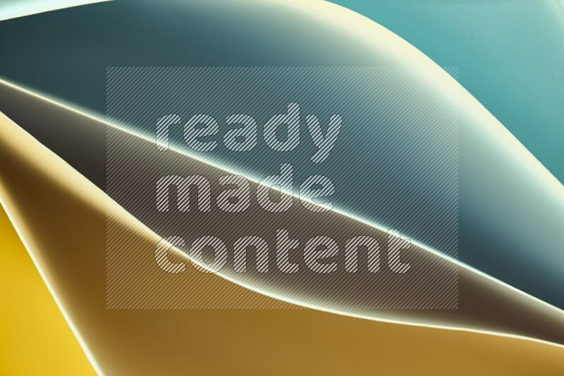 This image showcases an abstract paper art composition with paper curves in green and yellow gradients created by colored light