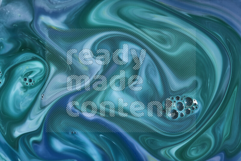 A close-up of abstract swirling patterns in blue and green