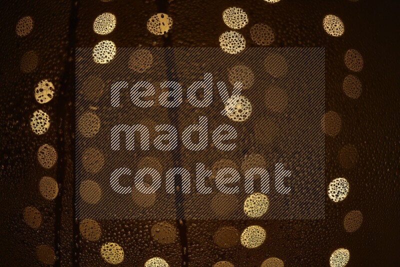 Bokeh light in yellow with water drops