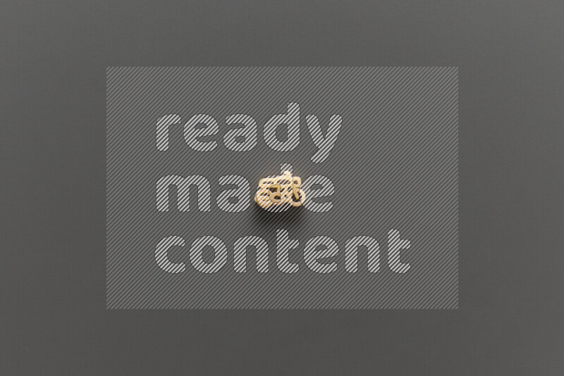 Shaped children pasta on grey background