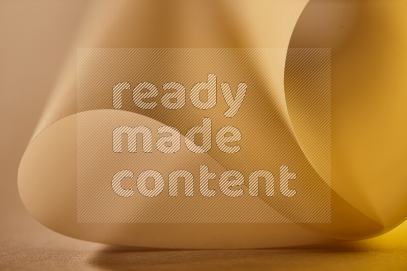 An abstract art piece displaying smooth curves in gold gradients created by colored light