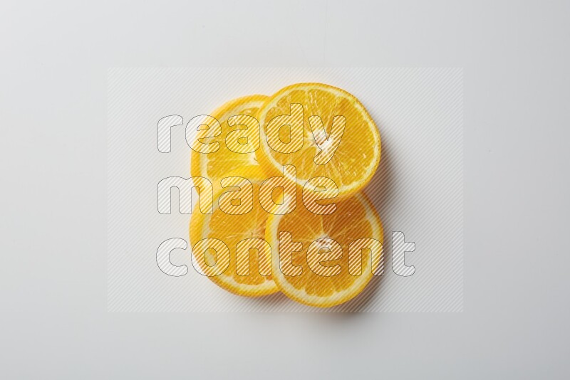 Four orange slices on a white background