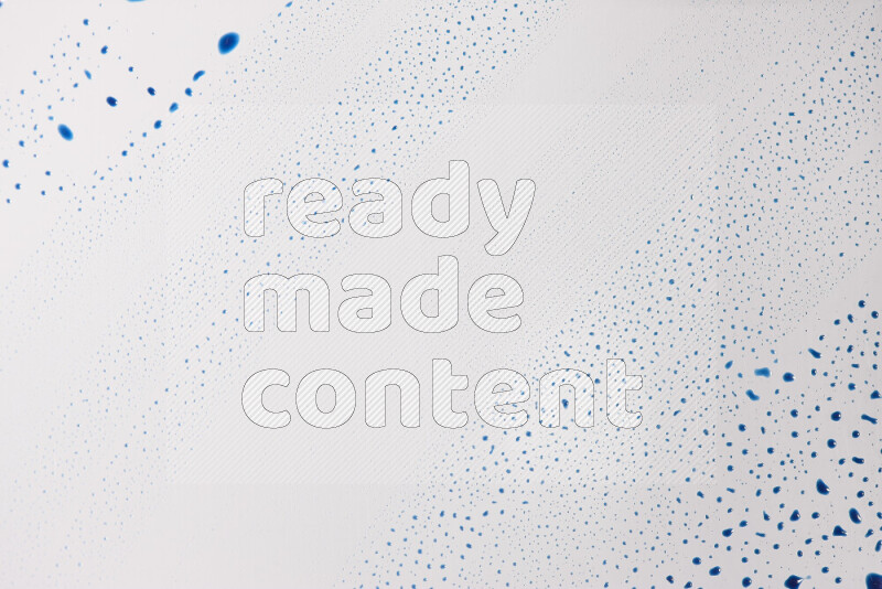 Close-ups of abstract blue paint droplets on the surface