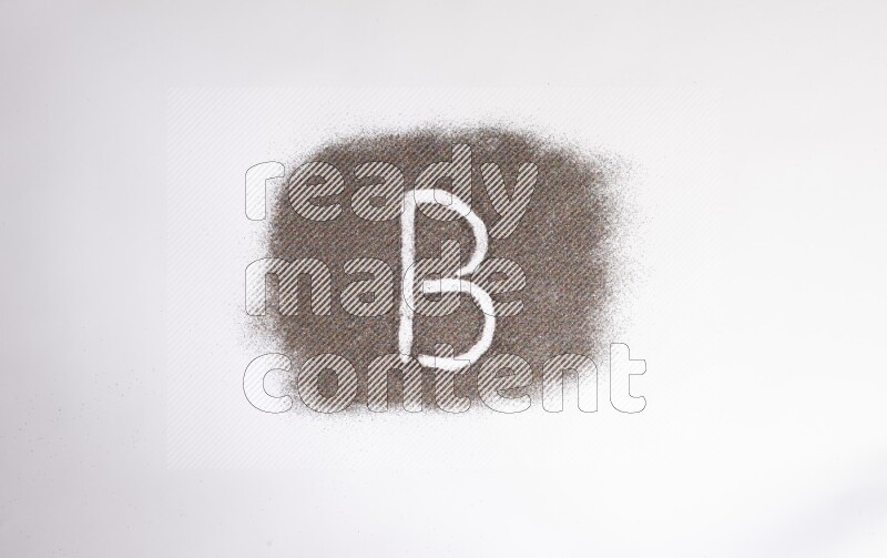 Alphabets written with glitter on white background