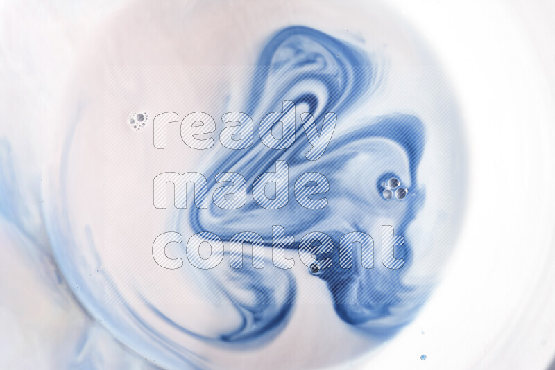 A close-up of abstract swirling patterns in blue and white