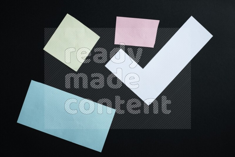 Multicolored paper sheet on black background