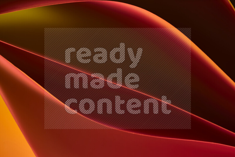 هذه الصورة تعرض تكوين فن الورق التجريدي مع منحنيات ورقية بتدرجات اللون الأصفر والأحمر والبني المكونه بواسطة الضوء الملون