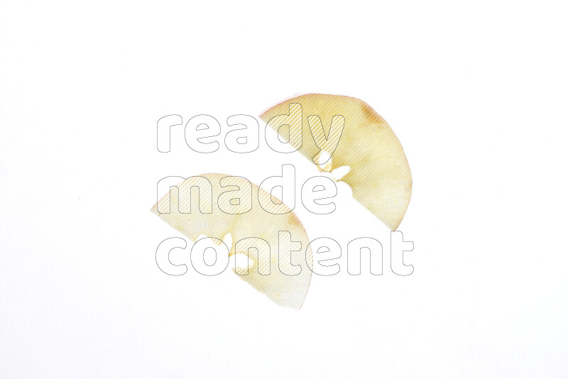 Apple slices on illuminated white background