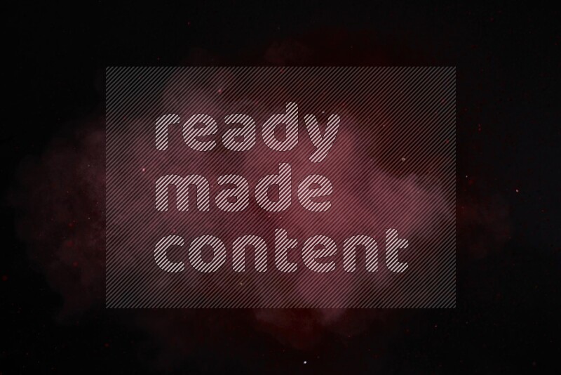 Red powder explosion on black background