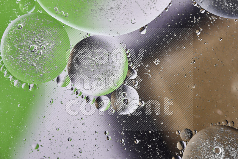 Close-ups of abstract oil bubbles on water surface in shades of brown, green and white