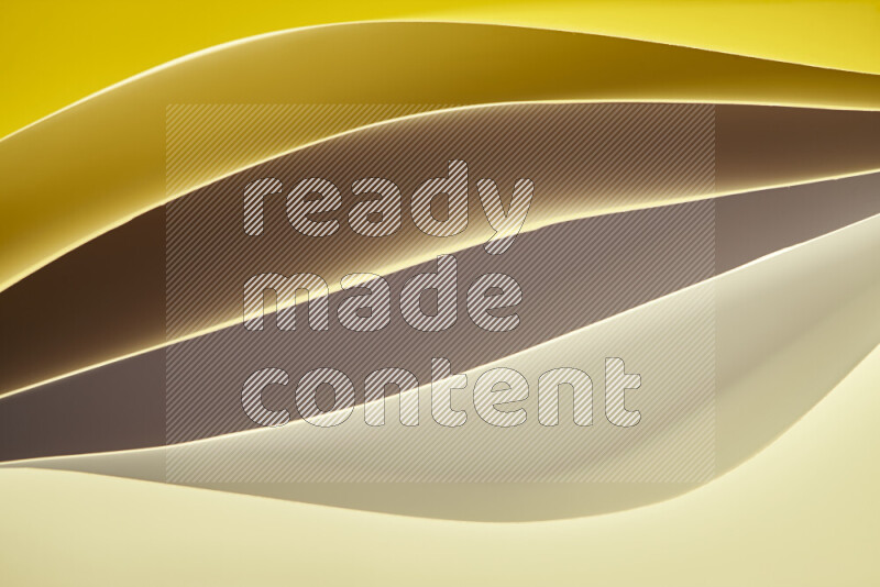This image showcases an abstract paper art composition with paper curves in gold gradients created by colored light
