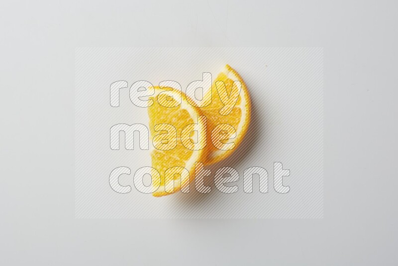 Two halves of an orange slices on white background